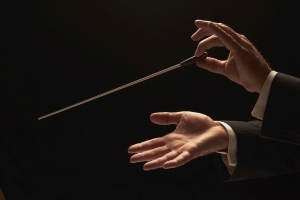 Conductor conducting an orchestra