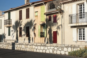 shadows of palm trees on walls in Antibes.